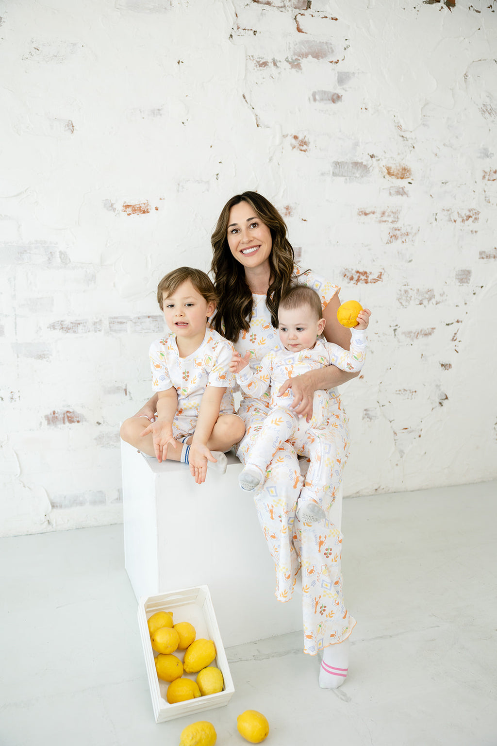 Mother with two children in matching Bianca & Bear Amalfi Pima cotton styles