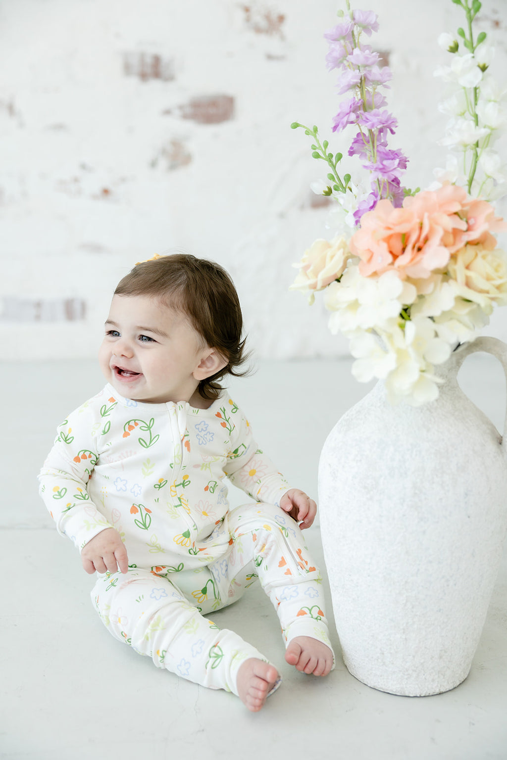 Baby wearing Bianca & Bear Floral Pima cotton zipper sleeper